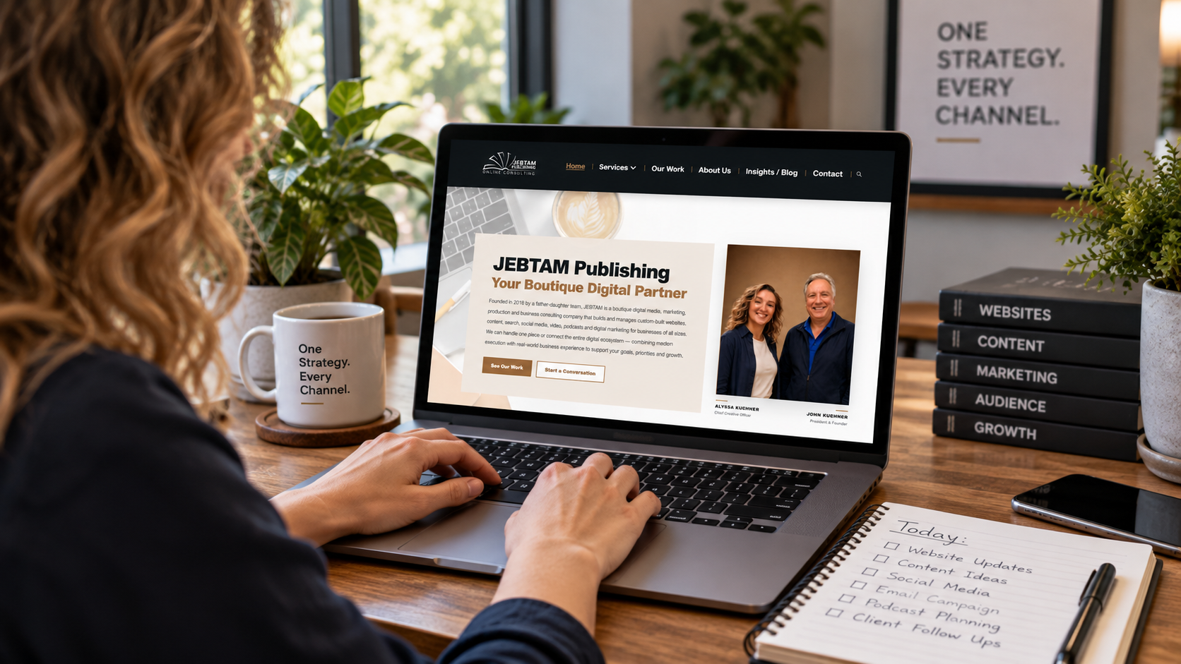 Woman working at a website as a digital marketing hub connecting content, search, social media and email.